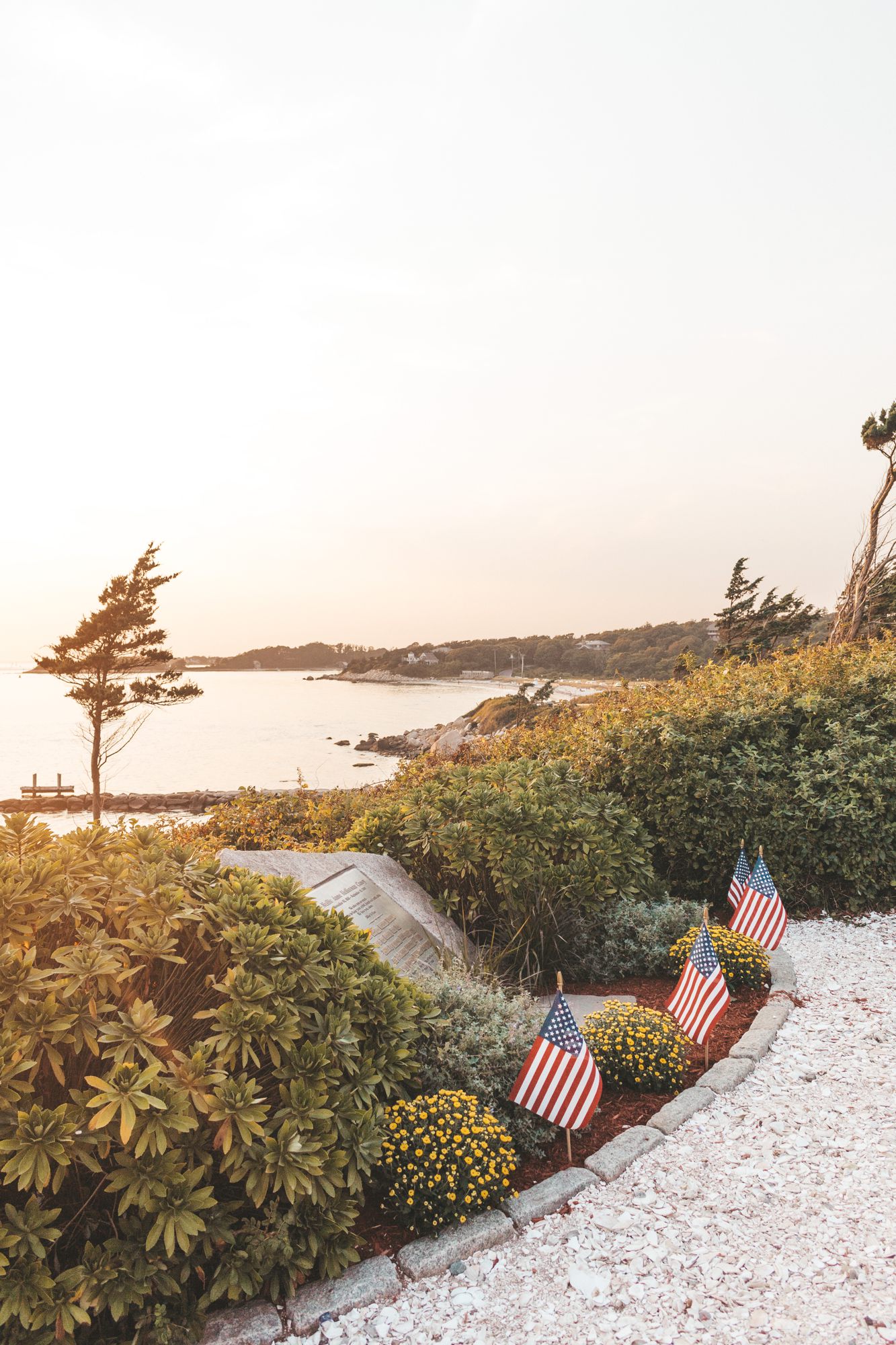 Path with small American flags at sunset