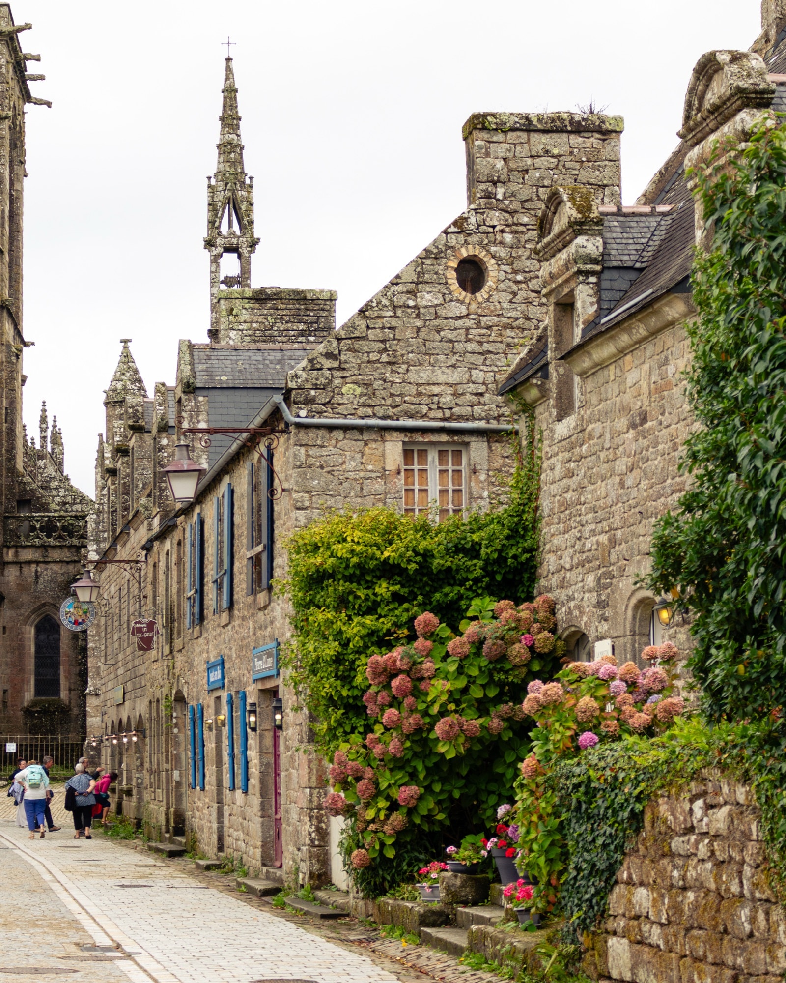 Church tower behind stone houses