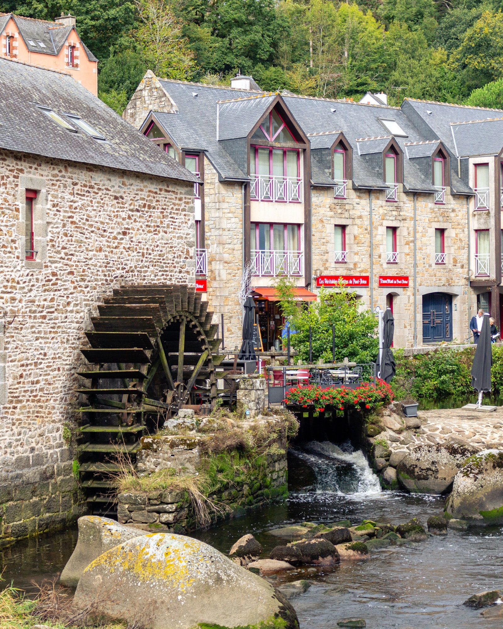 Water mill by a stream in a stone village